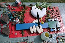 [ Tribute offerings on the Woodstock
memorial.  8/19/97 ]